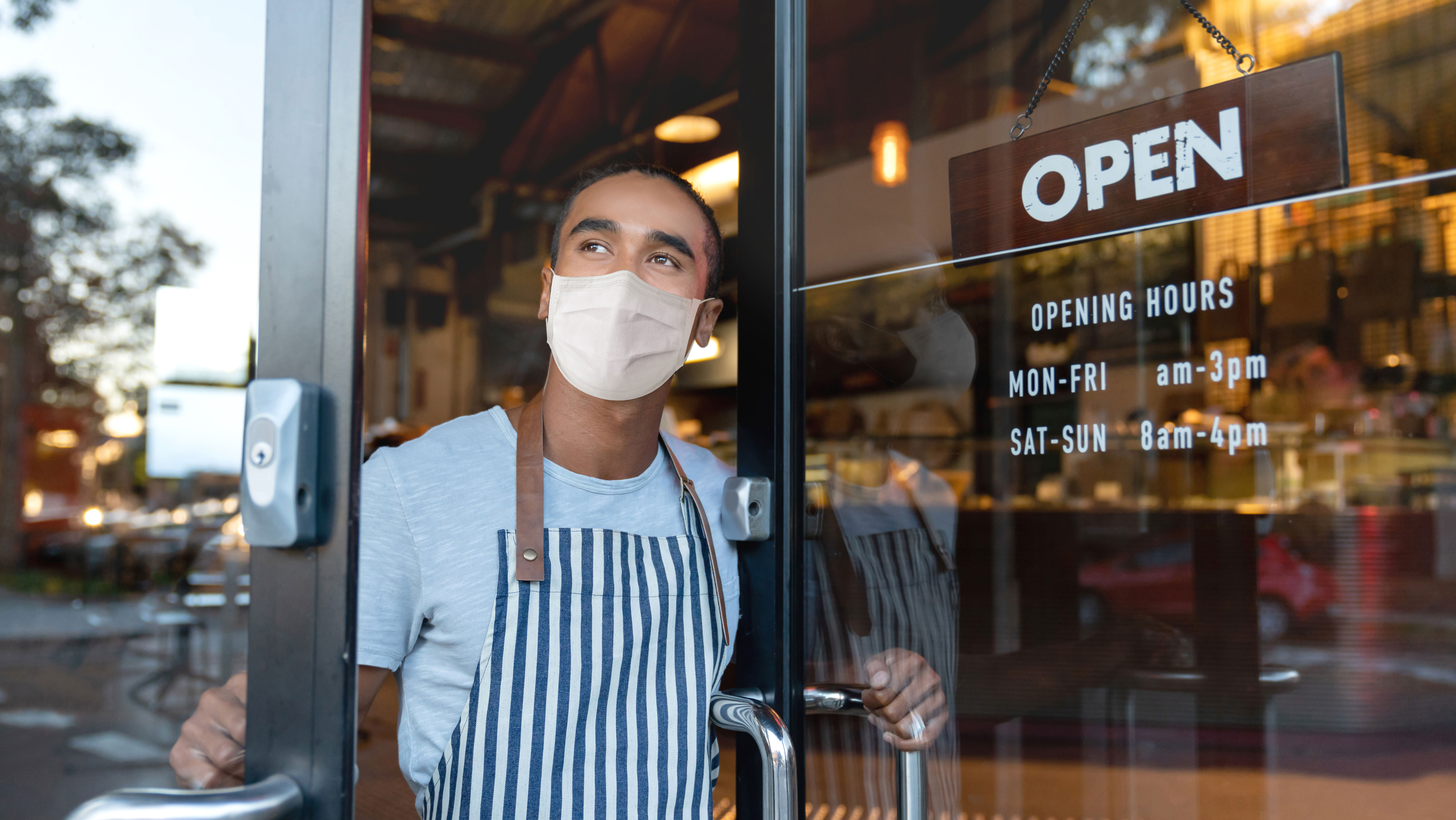 Small business owner in mask